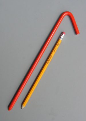 10 inch long steel tarp stake with baked on orange enamel painted coating with pencil for scale