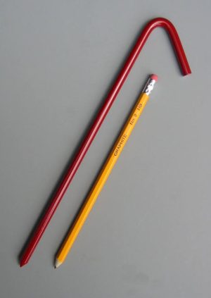 10 inch long steel tarp stake with baked on red enamel painted coating with pencil for scale