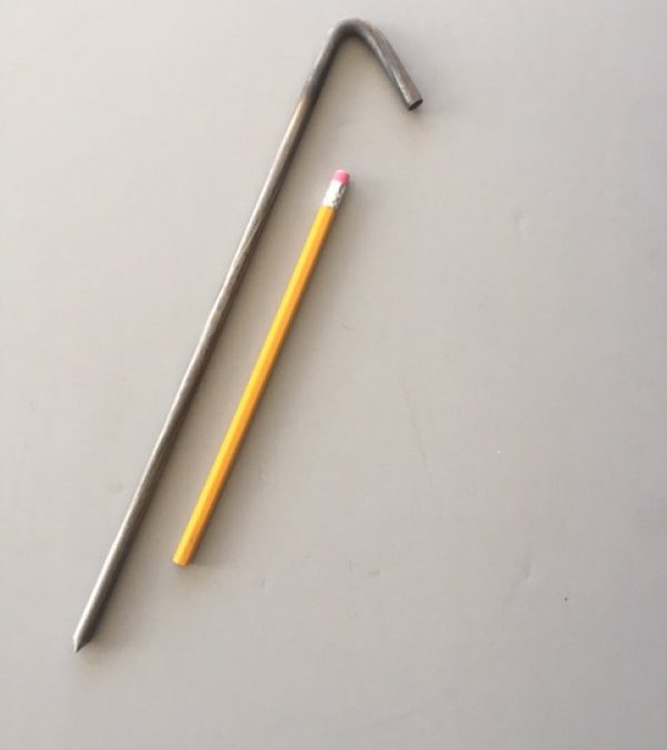 12 inch hook style metal tarp stake unpainted with pencil for scale