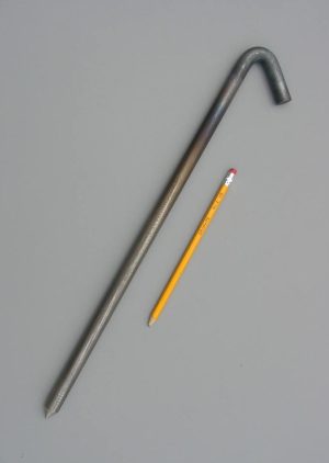 18 unpainted hook style steel tent stake with a pencil for scale