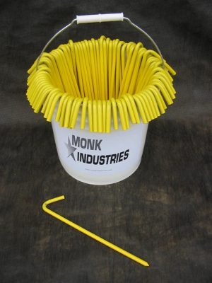 bucket with 100 pieces of 10" yellow tarp stakes hanging on it
